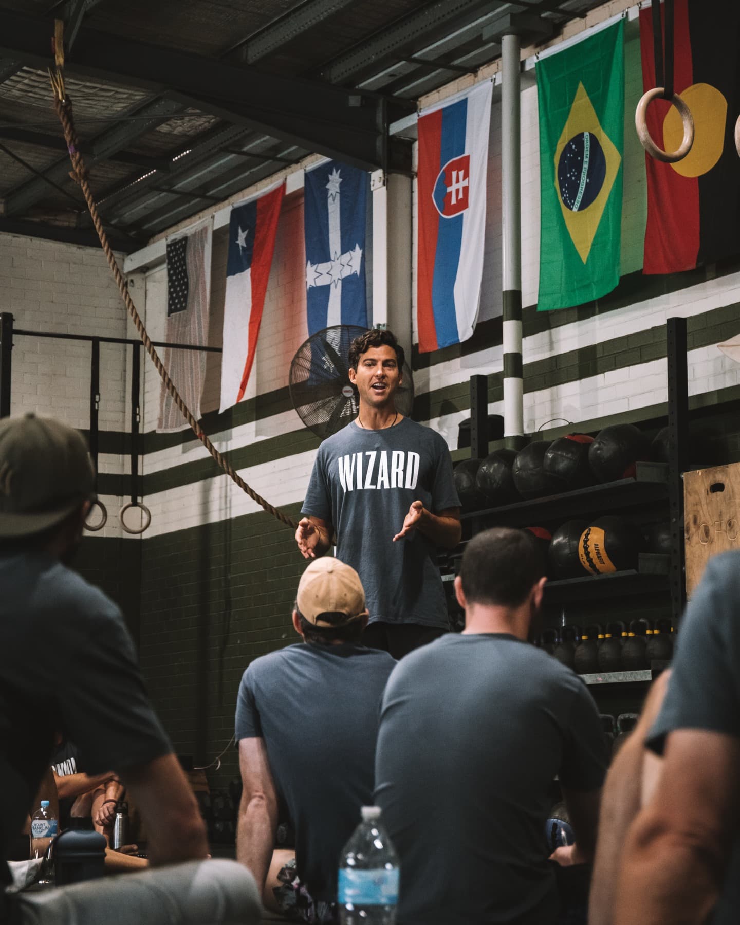 Josh Hamilton in his Wizard shirt leading a group of men in a gym